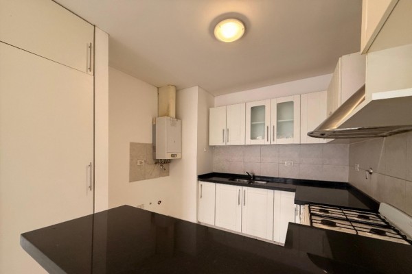 DEPARTAMENTO DOS DORMITORIOS CON COCHERA - EDIFICIO MELOS